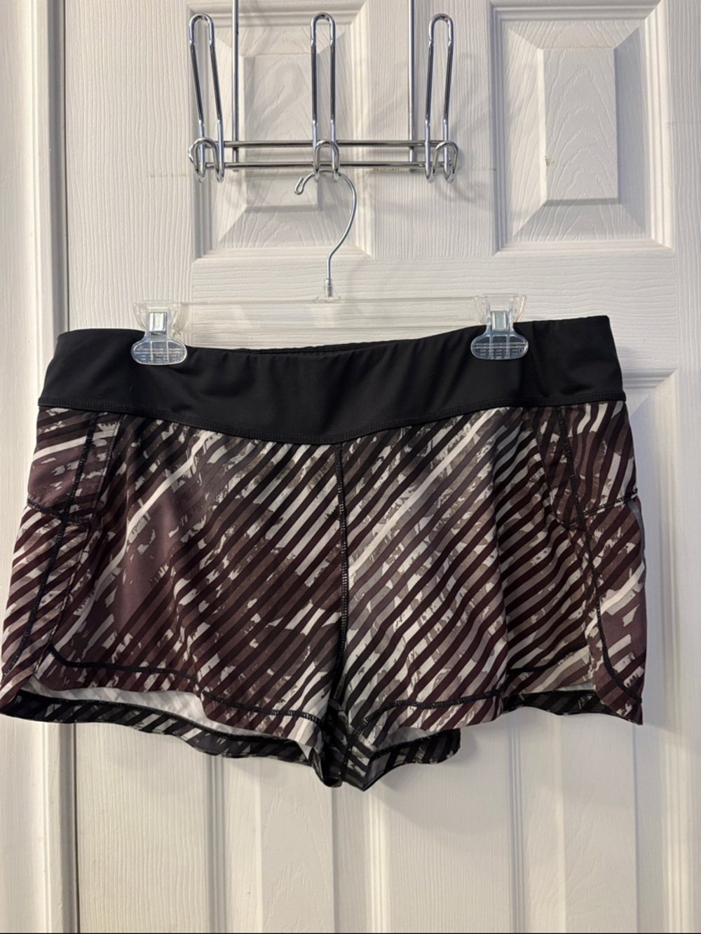 Athleta Women's Black & Dark Plum Striped Athletic Shorts with zip back pocket
